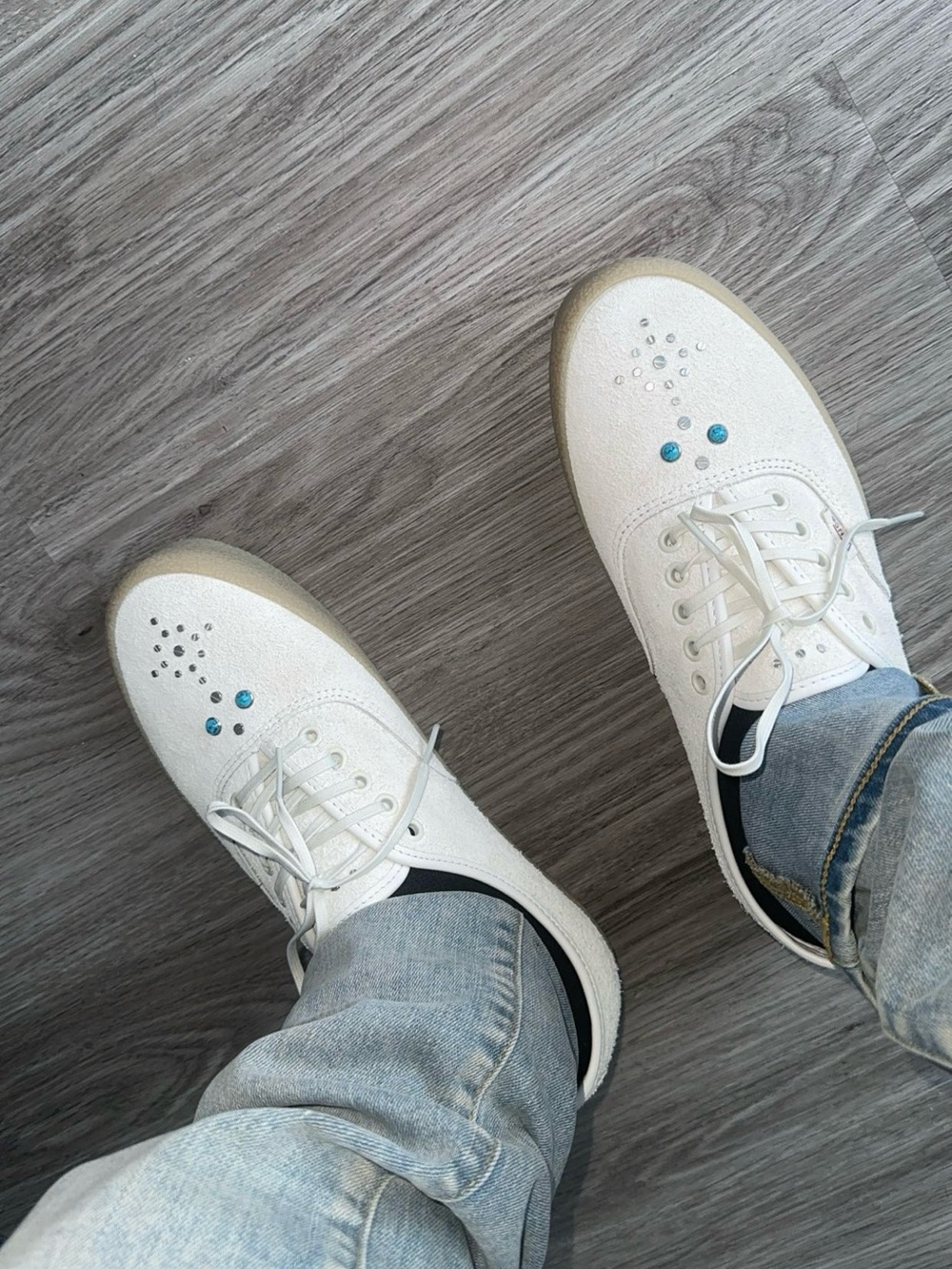 Vans White Sneakers with Blue Stud Accents